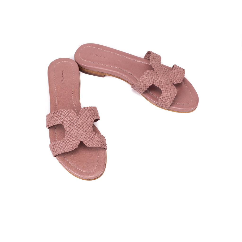 Pair of pink sandals with cross-straps 