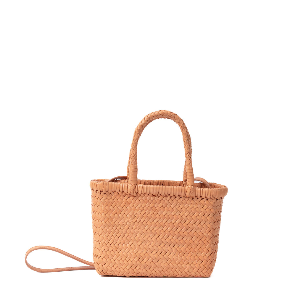Leather mini tote and sling bag in soft pastel orange shade with sleek finish